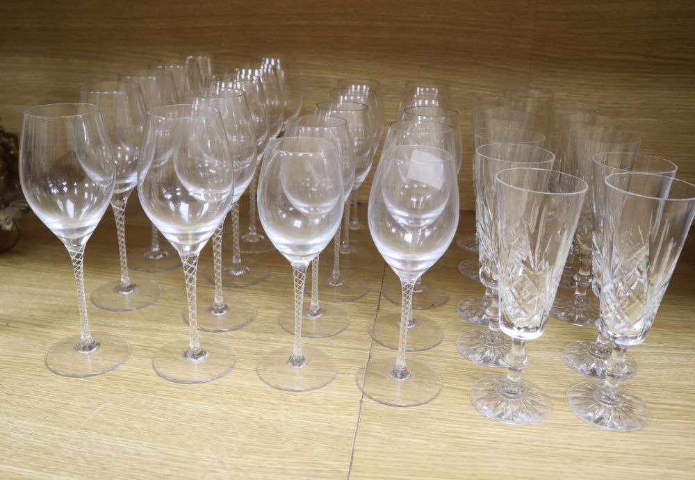 Twenty air twist stemmed wine glasses and eleven cut glass champagne flutes (31)